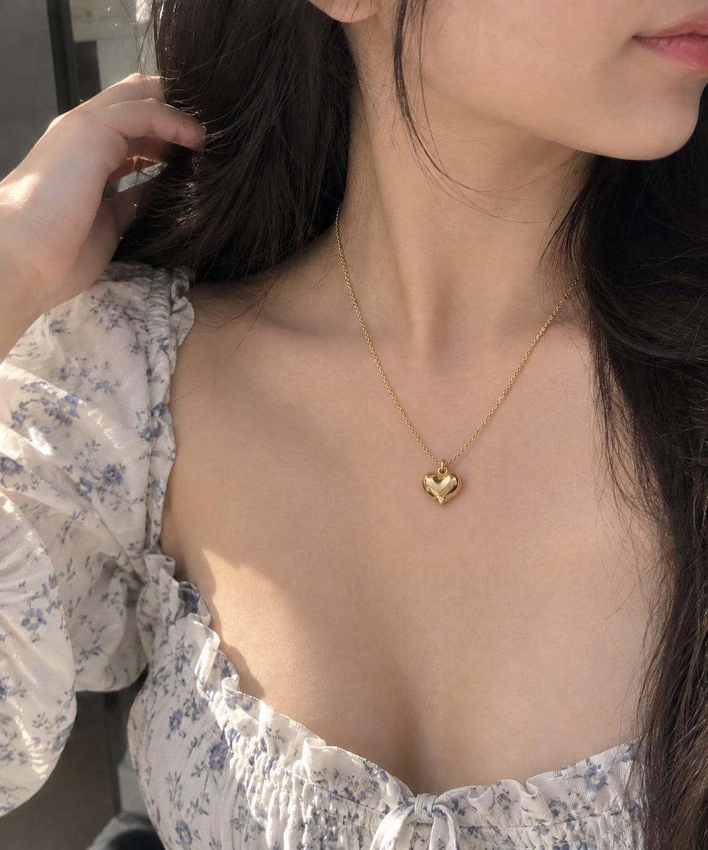 Elegant Gold Heart Pendant Necklace - Model wearing the necklace